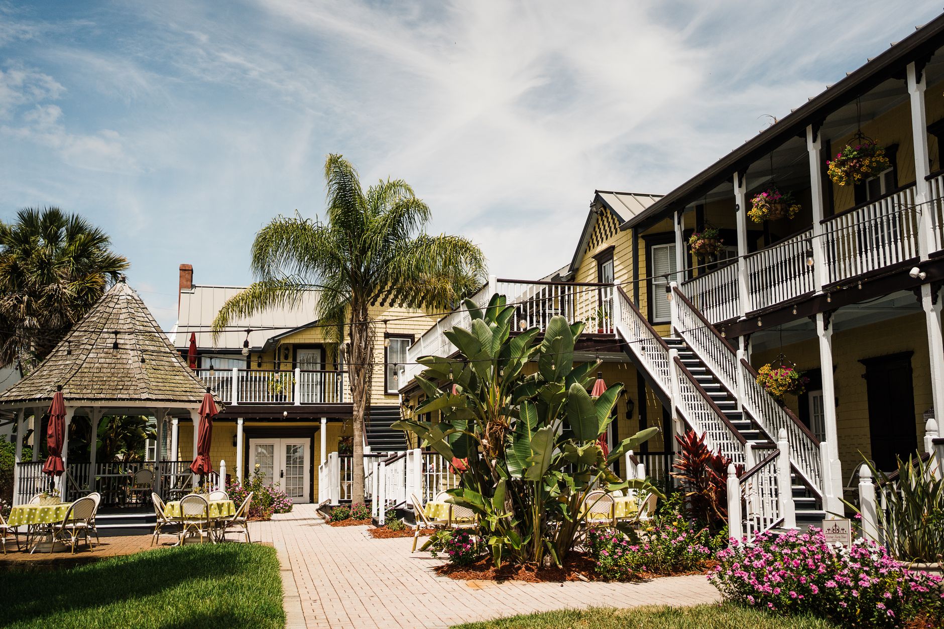 Brick paver walkway and patio surrounded by tropical landscaping, the kind of outdoor living space a paver patio brings to a Port St Lucie yard